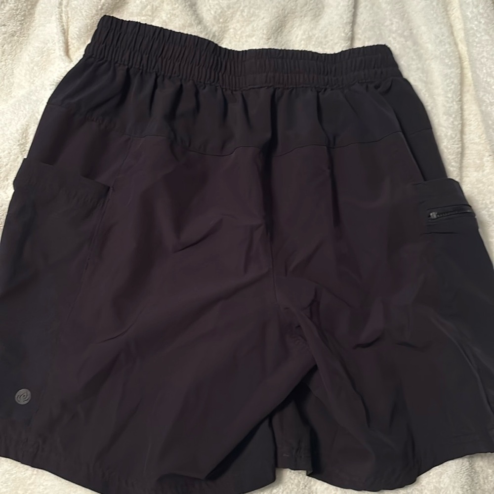 Men’s Small. Black athletic shorts. Polyester & spandex. 2 side pockets